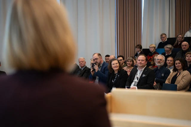 Guests and students listening in the auditorium at UiT.