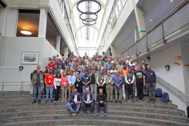 Midnight Sun Summit participants gathered on the stairs at UiT’s Narvik campus.